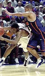 Penn State's Jamaal Tate, left, tries to drive around Illinois' Cory Bradford in the first half on Wednesday.