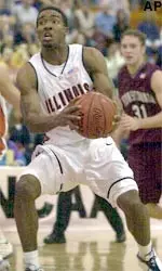 Illinois' Luther Head drives to the basket past Penn's Tim Begley during the Illini's 78-71 victory, Thursday.