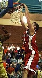 Robert Archibald dunks on Georgia Tech's Clarence Moore during the first half.