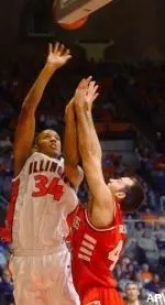 Brian Cook puts up a shot over Illinois State's Casey Reid in the first half Tuesday.