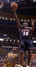 Guard Frank Williams puts in a layup over Missouri's Rickey Paulding.