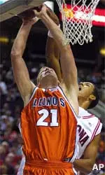 Illinois forward Robert Archibald tries to put up a shot over Arizona center Channing Frye in the first half of the Southwest Showdown Tuesday.