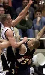 Purdue's Brett Buscher goes up to block the shot of Illinois guard Cory Bradford during the first half of Saturday's game.