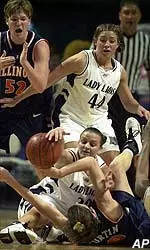 Penn State's Lisa Shepherd, on floor top, battles with Illinois' Allison Curtin, bottom floor, as teammate Ashley Luke, right, waits for the ball and Illiinois' Dawn Vana, left, tries to call a time out during the first half Thursday.