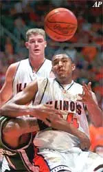 Illinois' Brian Cook fights for a rebound as Michigan State's Charlie Bell gets an arm around him during the first half of Tuesday's game. Cook finished with 12 points.