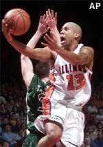 Illinois guard Cory Bradford gets inside Charlotte defender Jobey Thomas for a layup in the first half of the Illini's 79-61 victory Sunday.