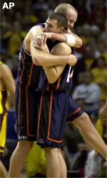 Illinios' Sean Harrington, right, and Lucas Johnson celebrate their share of the Big Ten Championship after Sunday's game. Illinios will share the Big Ten Championship with Michigan State after beating Minnesota 67-59.