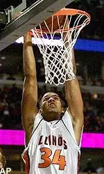 Illinois forward Brian Cook finishes off a slam dunk during first half action against Purdue in the Big Ten basketball tournament Friday.