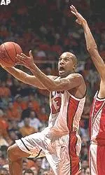 Illinois' Cory Bradford drives for a shot past Wisconsin's Dave Mader after a steal late in the first half of their game Wednesday.