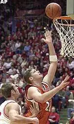 Illinois center Robert Archibald, right, goes up for a shot while guarded by Indiana forward Jarrad Odle during the first half in Bloomington.