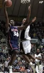 Illinois guard Frank Williams, left, holds off Purdue's Willie Dean as he shoots during the first half of their game Wednesday.