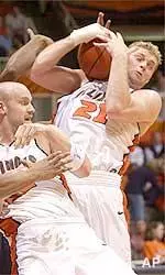 Robert Archibald scrambles for a rebound in the first half of Illinois' win over Penn State Wednesday.