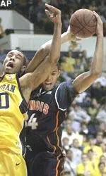 Brian Cook pulls down an offensive rebound over Michigan's LaVell Blanchard during the first half of the Illini's 68-60 victory.