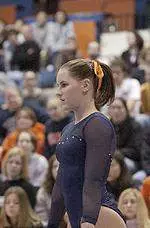 Freshman Ashley scored a career-best 9.875 to tie for first on the uneven bars Friday at Denver.