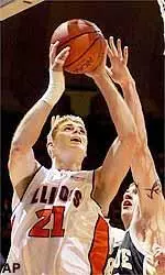 Illinois' Robert Archibald goes up for a shot as Purdue's Kevin Garrity defends during the first half in Champaign.