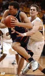 Deron Williams drives around Iowa's Jeff Horner during the first half on Wednesday.
