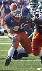 E. B. Halsey runs through Michigan State defenders during the first half.
