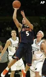Deron Williams shoots over Providence forward Tuukka Kotti, left, and guard Donnie McGrath.
