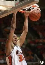 Brian Cook slams home two of his team-high 22 points late in the second half of Illinois' 76-57 win over Ohio State Sunday afternoon. (AP photo by Robert K. O'Daniell)