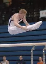 Justin Spring notched a career-high 8.975 on the parallel bars to qualify for the event finals on Saturday.