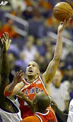 James Augustine shoots between Georgetown defenders.