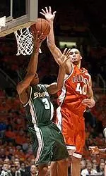 James Augustine blocks a shot by MSU's Shannon Brown during the second half.
