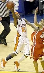 Dee Brown holds off Wisconsin's Devin Harris as he shoots during the first half.