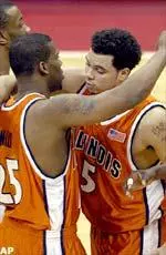 Deron Williams gets a hug from teammate Jerrance Howard late in the game in thier win against Cincinnati.
