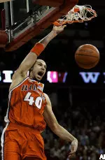 James Augustine slam dunks in the first half against Wisconsin.