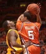 Deron Williams is pressured by Minnesota's Vincent Grier during the first half.