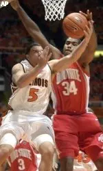 Deron Williams lays the ball up under the basket in front of Ohio State's Terence Dials in the first half.