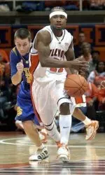 Dee Brown races downcourt ahead of South Dakota State Matt Cadwell (24) in the first half. (AP Photo/Robert K. O'Daniell)