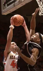 James Augustine goes up for a shot as Arkansas Rashad Jones-Jennings, right, defends. (AP Photo/Robert K. O'Daniell)