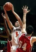 Deron Williams goes up for a basket as Wisconsin's Mike Wilkinson tries to stop him during the first half.