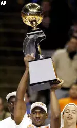 Roger Powell Jr. hoists the Big Ten championship trophy.