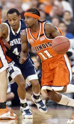 Dee Brown drives on Nevada guard Mo Charlo.