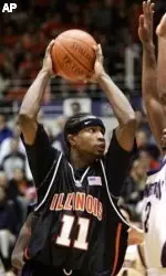 Illinois' Dee Brown drives on Northwestern's Joe Kennedy during second half. (AP Photo/M. Spencer Green)