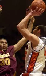 Shaun Pruitt looks to pass around Minnesota's Rico Tucker in first half.