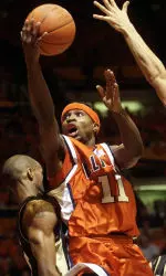 Illinois' Dee Brown drives in for a layup over Purdue's Bryant Dillon during first half. (AP Photo/Robin Scholz)