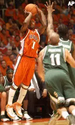 Dee Brown shoots as Michigan State defenders try to stop him in first half in Assembly Hall Thursday night.