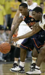 Jamar Smith fights for a loose ball with Iowa's Mike Henderson during the first half.