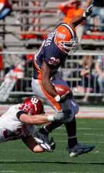 Illinois' Pierre Thomas Jr. (30) escapes the grasp of Indiana's Will Meyers (39). (AP Photo/Seth Perlman)