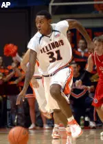 Jamar Smith takes the ball up the court.
