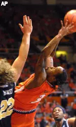 Illinois' Chester Frazier (3) loses his balance as he shoots while Georgia Southern's Ryan Hynes (22) defends during the first half. (AP Photo/Robert K. O'Daniell)