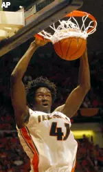 Warren Carter dunks the ball during the first half.