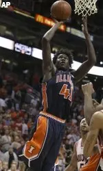 Illinois' Warren Carter (41) scores two of his game-high 24 points during the second half. (AP Photo/Paul Connors)