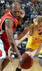 Illinois' Rich McBride, left, and Michigan's Graham Brown vie for control of the ball during the first half of a college basketball game, Tuesday, Feb. 21, 2006, in Ann Arbor, Mich. (AP Photo/Al Goldis)