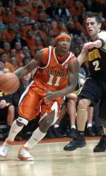 Illinois' Dee Brown drives past Iowa's Jeff Horner in first half. (AP Photo/John Dixon)