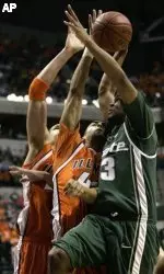 Illinois forward Brian Randle (42), center, rejects a shot by Michigan State guard Maurice Ager (13) in the first half of the Big Ten men's basketball tournament Friday, March 10, 2006, in Indianapolis. At left is Illinois center James Augustine. (AP Photo/Michael Conroy)