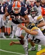 Illinois's E.B. Halsey (26) gets through the hands of Iowa's Alex Willcox, right, during the football game. (AP Photo/Seth Perlman)
